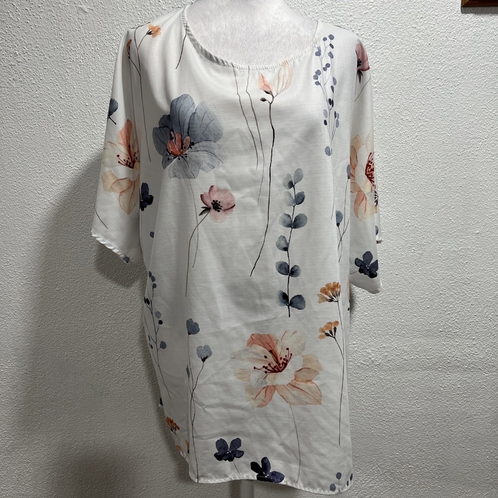 Zolucky(1X) multicolor pullover Dolman sleeve blouse w/ floral pattern.